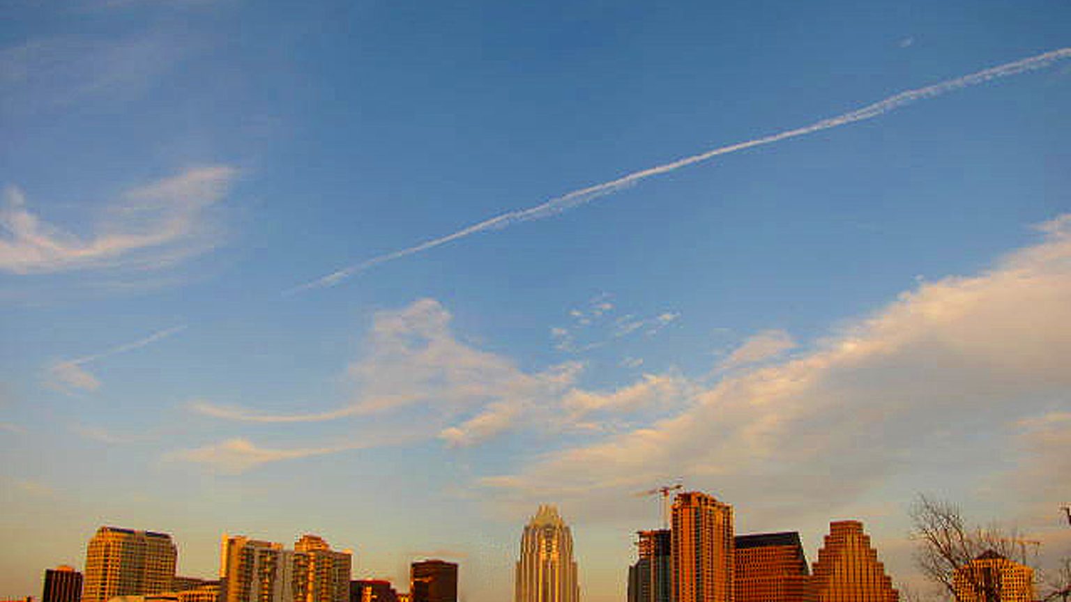 Downtown Austin skyline at sunset seen across Lady Bird Lake